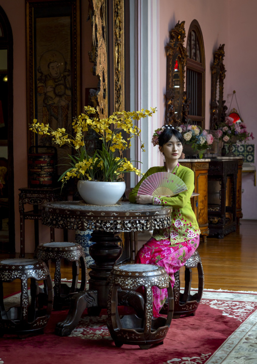 Young chinese woman dressed in traditional clothing in Pinang Peranakan mansion, Penang island, George Town, Malaysia