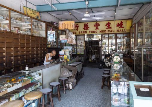 Old man in a chinese medical hall, Penang island, George Town, Malaysia