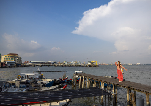 Asian tourist in Chew Jetty, Penang island, George Town, Malaysia