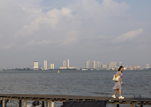 Asian tourist in Chew Jetty, Penang island, George Town, Malaysia