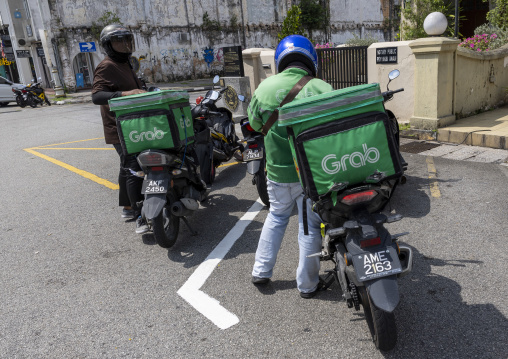 Bikers from the popular take away food delivery company Grab, Perak, Ipoh, Malaysia