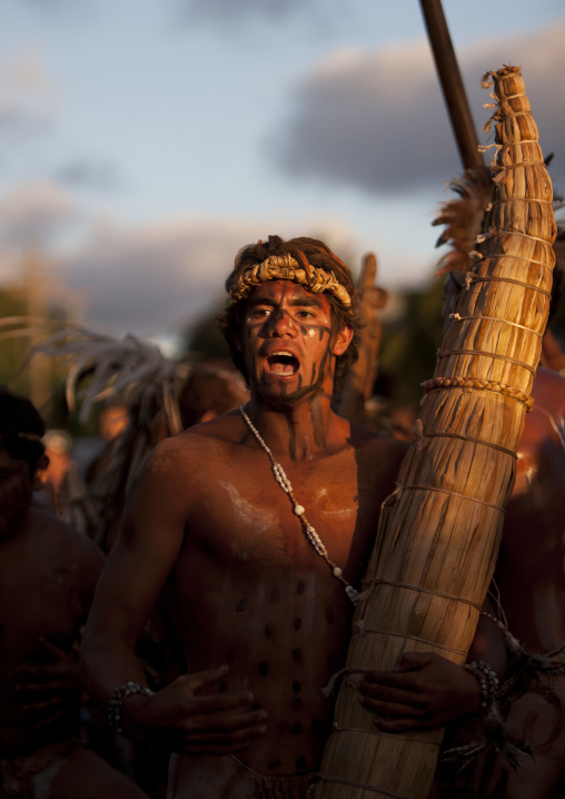 Man with totora boat during tapati festival, Easter Island, Hanga Roa, Chile