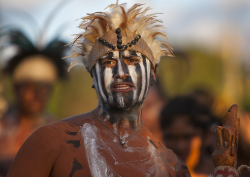 Man with traditional make up during tapati festival, Easter Island, Hanga Roa, Chile