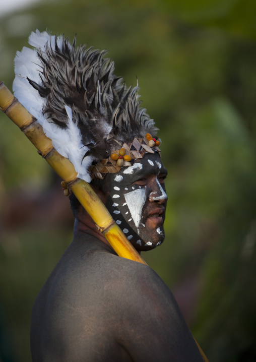 Man with traditional make up during tapati festival, Easter Island, Hanga Roa, Chile