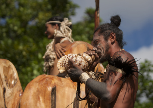 Warrior blowing in a shell during carnival in Tapati festival, Easter Island, Hanga Roa, Chile