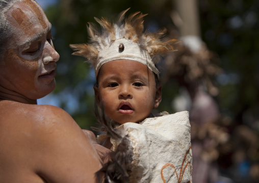 Father and kid during tapati festival, Easter Island, Hanga Roa, Chile