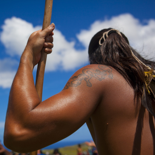 Back of a native man during spear competition at Tapati festival, Easter Island, Hanga Roa, Chile