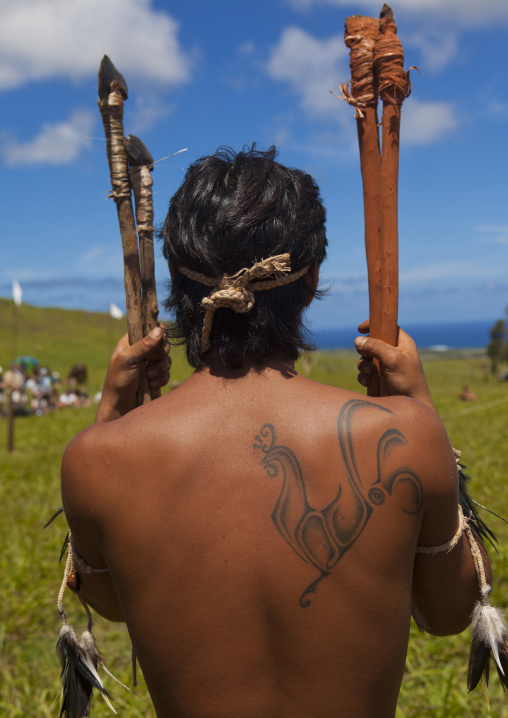 Back of a native man during spear competition at Tapati festival, Easter Island, Hanga Roa, Chile