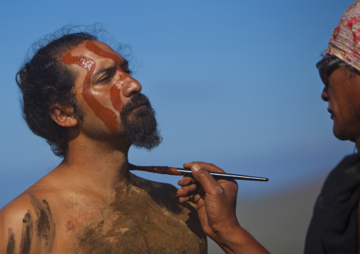 Haka pei body painting before the banana competition during tapati festival, Easter Island, Hanga Roa, Chile