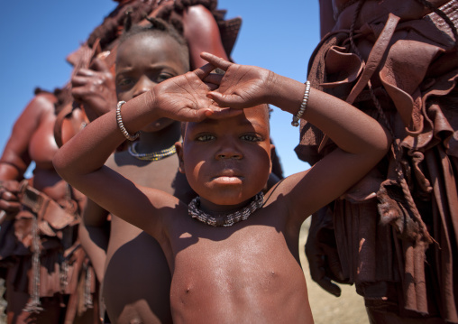 Muhimba Kid Protecting From The Sun With His Hands, Village Of Elola, Angola