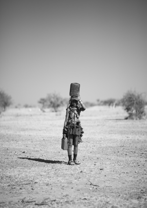 Muhimba Woman Carrying Jerrycans, Village Of Elola, Angola