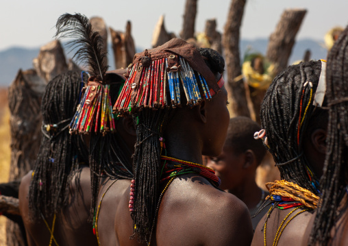 Muhacaona tribe women with kapapo headdress made of soda cans, Cunene Province, Oncocua, Angola