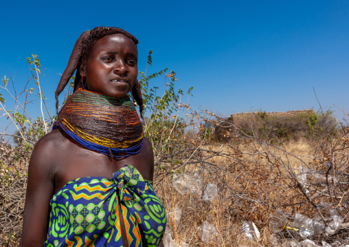 Portrait of a Mumuhuila tribe woman portrait wearing a huge necklace, Huila Province, Chibia, Angola