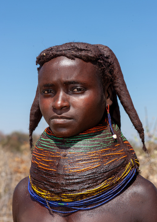 Portrait of a Mumuhuila tribe woman portrait wearing a huge necklace, Huila Province, Chibia, Angola