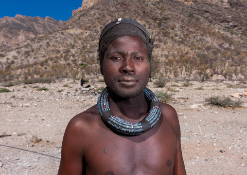 Himba tribe man with the traditional necklace, Cunene Province, Oncocua, Angola