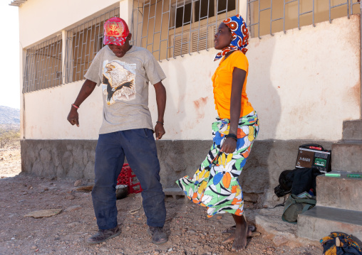 Angolan teenagers dancing in the street, Namibe Province, Iona National Park, Angola