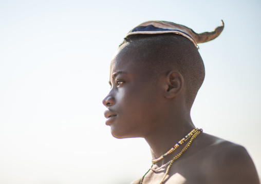 Portrait of a single Himba tribe young man, Cunene Province, Oncocua, Angola