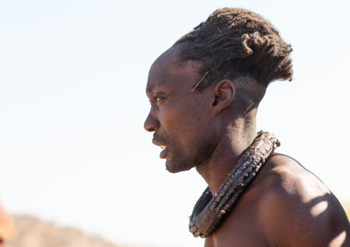 Portrait of a Himba tribe man with a traditional necklace, Cunene Province, Oncocua, Angola