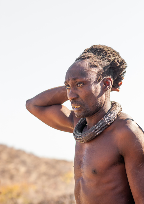 Portrait of a Himba tribe man with a traditional necklace, Cunene Province, Oncocua, Angola