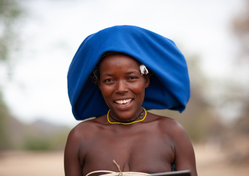 Mucubal tribe woman wearing a blue headwear, Namibe Province, Virei, Angola