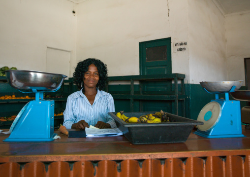 Angolan woman selling bananas in a shop, Namibe Province, Namibe, Angola