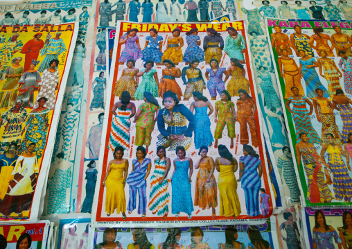 Tailor shop poster depicting wax dresses, Namibe Province, Namibe, Angola