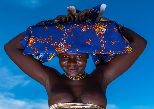 Mucubal tribe woman wearing a colorful headwear, Namibe Province, Virei, Angola