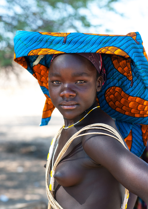 Portrait of a Mucubal tribe young woman wearing a colorful headwear, Namibe Province, Virei, Angola