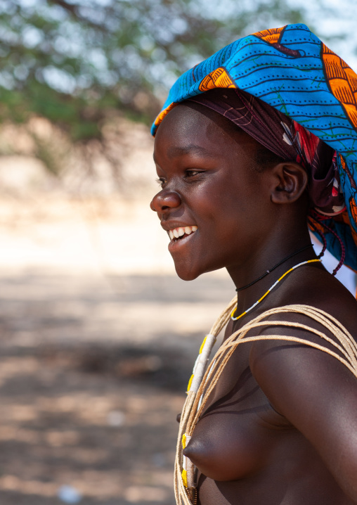 Portrait of a Mucubal tribe young woman wearing a colorful headwear, Namibe Province, Virei, Angola