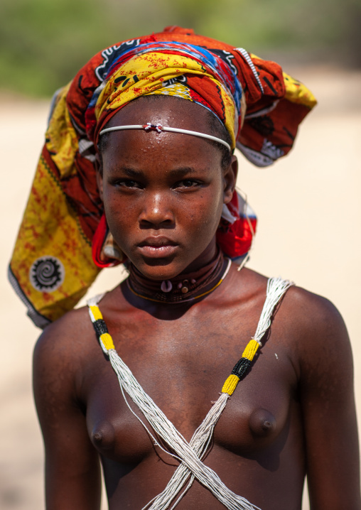 Portrait of a Mucubal tribe young woman wearing a colorful headwear, Namibe Province, Virei, Angola