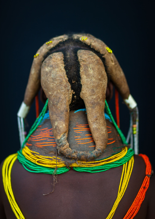 Rear view of a Mumuhuila tribe woman, Huila Province, Chibia, Angola