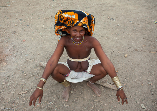 Mucubal tribe woman wearing a colorful headwear, Namibe Province, Virei, Angola