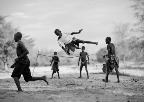 Mukubal Kids Doing High Jumping, Virie Area, Angola