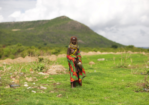 Mwila Woman With Special Hairstyle Walking In The Bush, Chibia Area, Angola