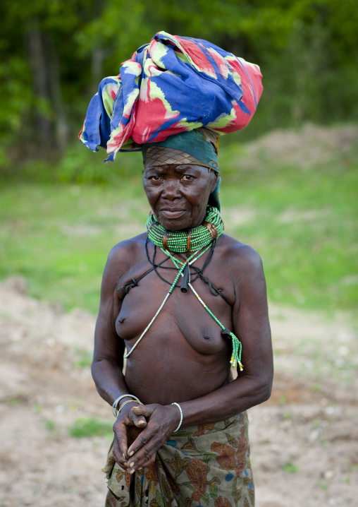 Old Mugambue Woman  Carrying A Bundle On Her Head, Angola