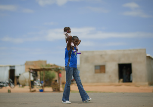 Mother Carrying Her Daughter On Her Shoulder, Lubango, Angola