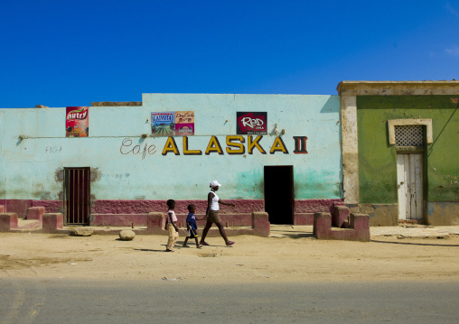 Woman Passing By A Pub With Her Children, Namibe Town, Angola