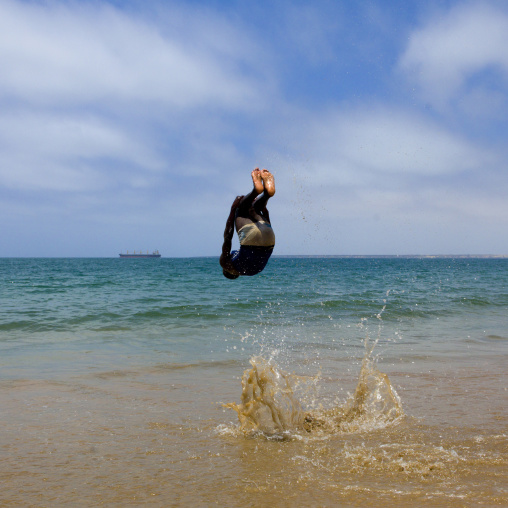 Boy Dancing Capoeira On The Beach, Angola