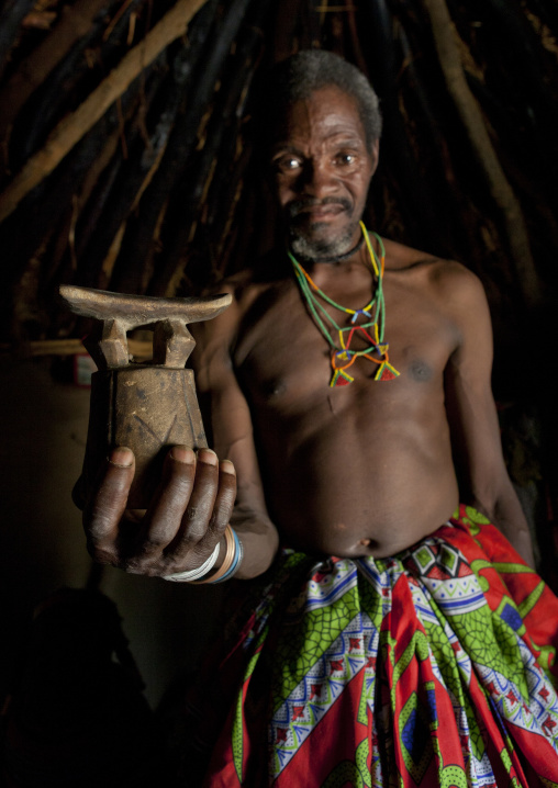 Mwila Man Holding A Headrest, Angola