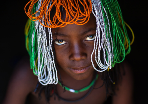 Muhakaona tribe girl with a beaded wig used for the fico ceremony, Cunene Province, Oncocua, Angola