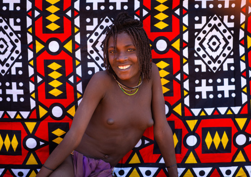 Smiling batwa tribe young woman who will soon be married, Cunene Province, Oncocua, Angola