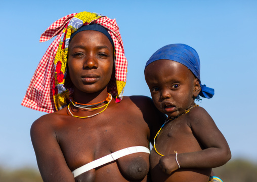 Mucubal tribe woman with her child suffering of intellectual disability, Namibe Province, Virei, Angola