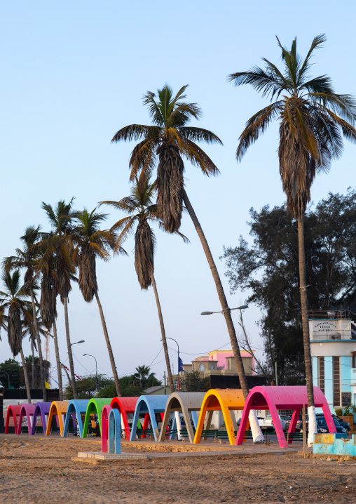 Palm trees and umbreallas on Miragens beach, Namibe Province, Namibe, Angola