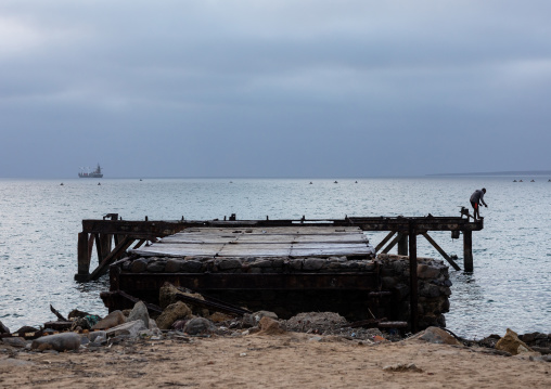 Damaged jetty on praia das Miragens, Namibe Province, Namibe, Angola