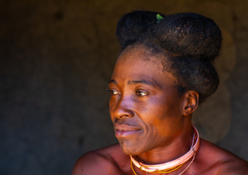 Nguendelengo tribe woman with the traditional bun hairstyle, Namibe Province, Capangombe, Angola