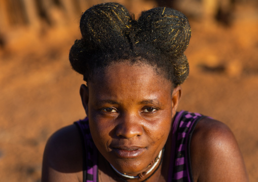 Nguendelengo tribe woman with the traditional bun hairstyle, Namibe Province, Capangombe, Angola