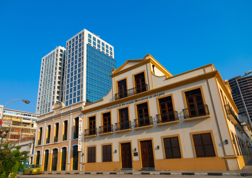 Old portuguese colonial building in front of a new skyscraper, Luanda Province, Luanda, Angola