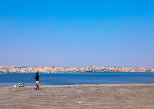 Men fishing on the jetty, Benguela Province, Lobito, Angola