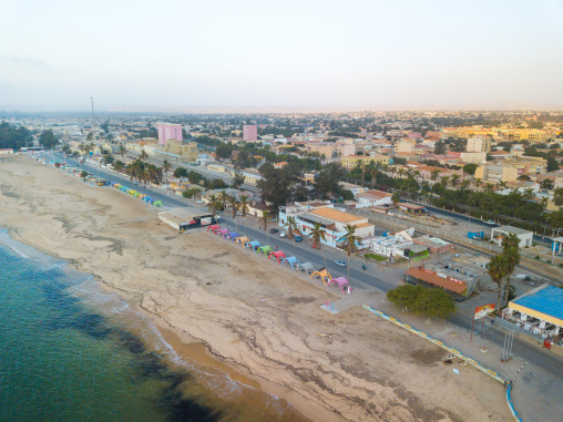 Aerial view of palm trees and umbreallas on Miragens beach, Namibe Province, Namibe, Angola