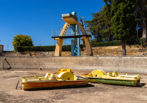 Paddle boats in front of the diving board in piscina da senhora do monte, Huila Province, Lubango, Angola